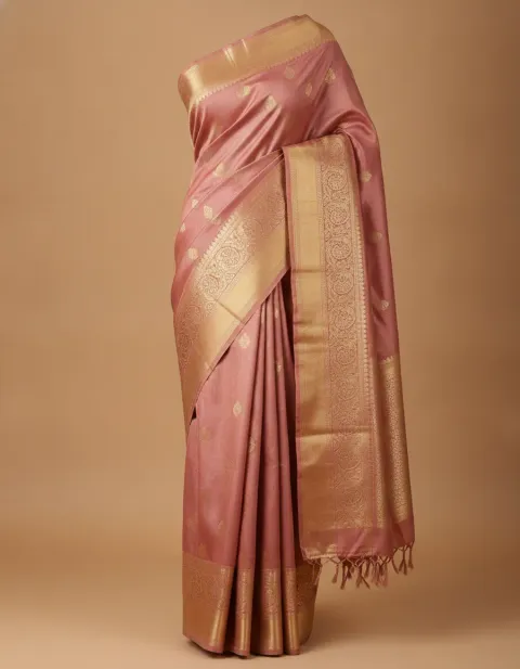The seller's product photo: a rose-gold Kanjivaram silk saree on a dress form