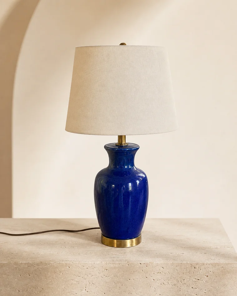 The same cobalt-blue table lamp transformed into a clean catalog photograph