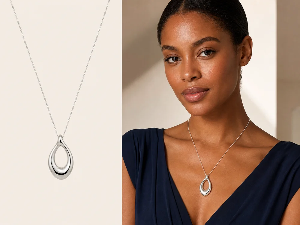 A silver necklace shown by itself and naturally worn by a Black model using AI virtual try-on